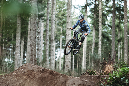 Mountain Biking Man Gets Big Air off Jump